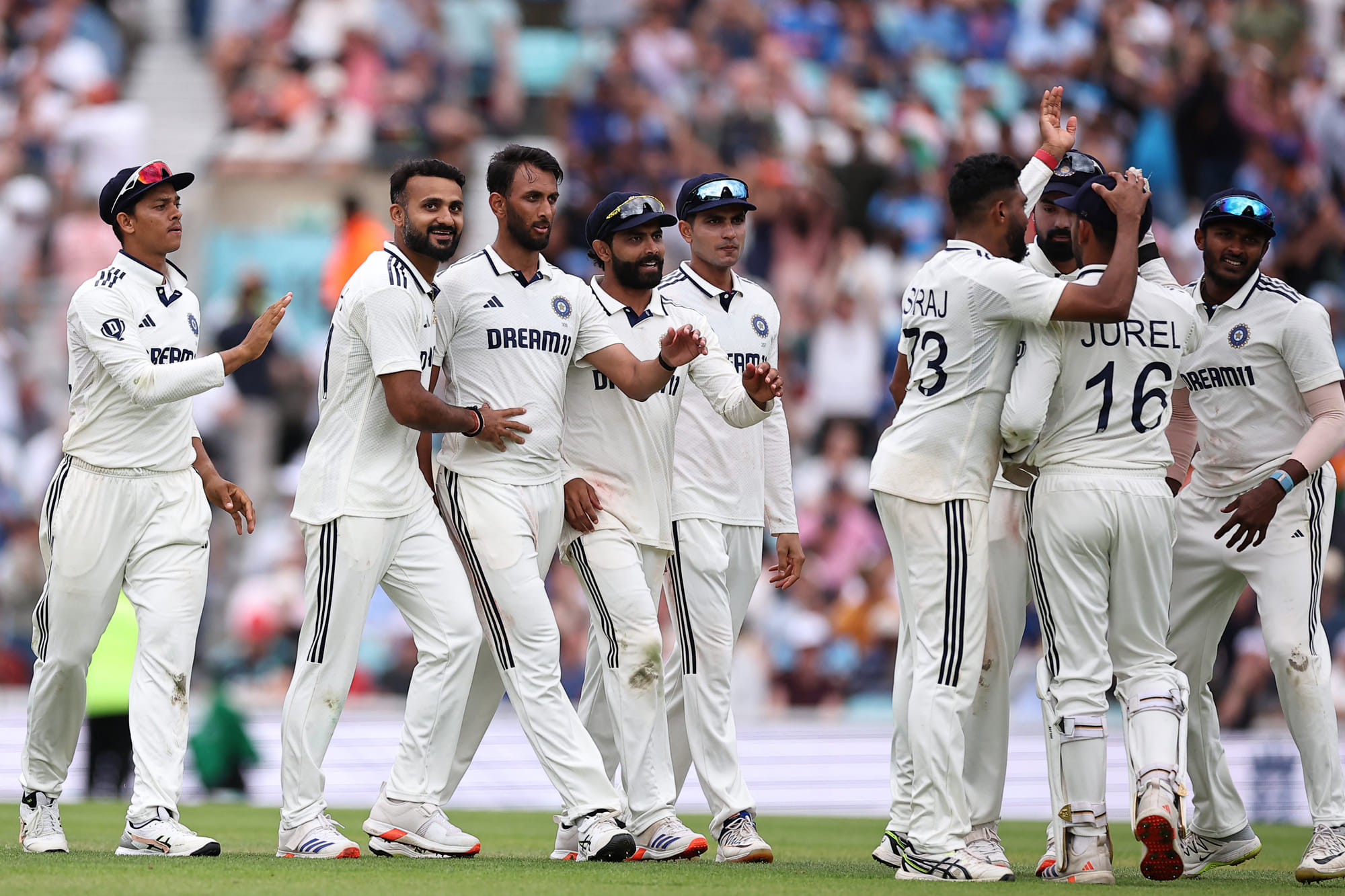 India players celebrate after India's Prasidh Krishna (third from left) dismissed England's Joe Root at The Oval in London on Sunday.