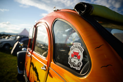 This photograph shows a sticker sticked on a Citroen 2CV vehicle, parked at a camp during the 25th World Meeting of 2CV Friends in Postojna, Slovenia on July 30, 2025.