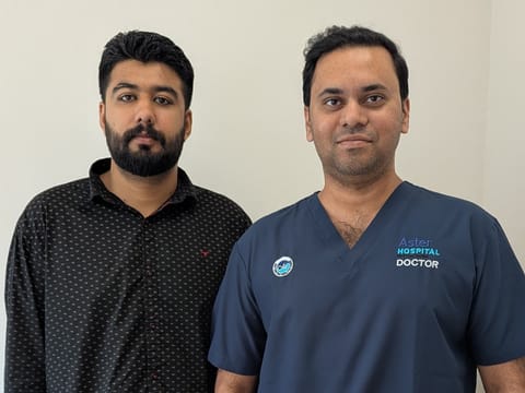 Muhammad Bilal with Dr Roshan Rodney S at Aster Hospital Mankhool after successful treatment.