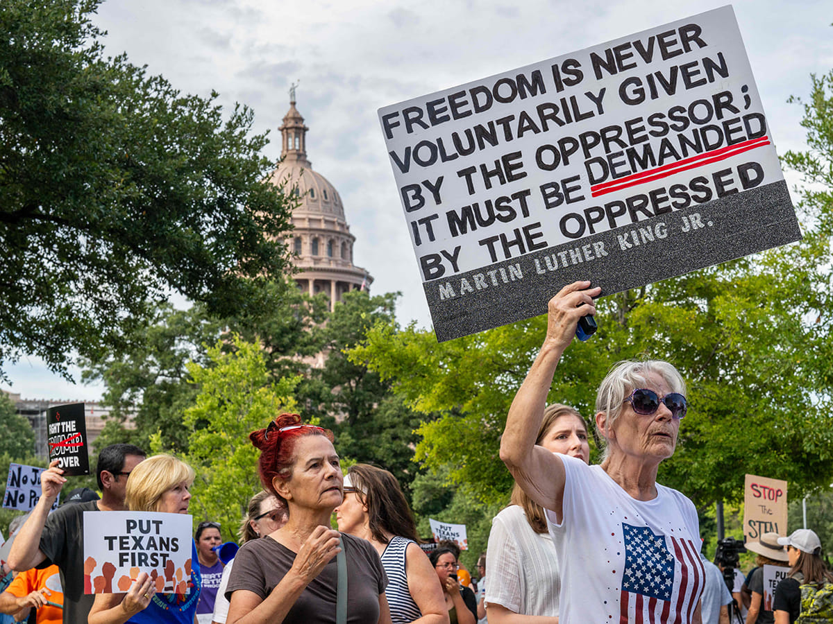People protest against the recently introduced redistricting legislation during an emergency march and picket rally outside of the Governor's Mansion on August 04, 2025 in Austin, Texas.