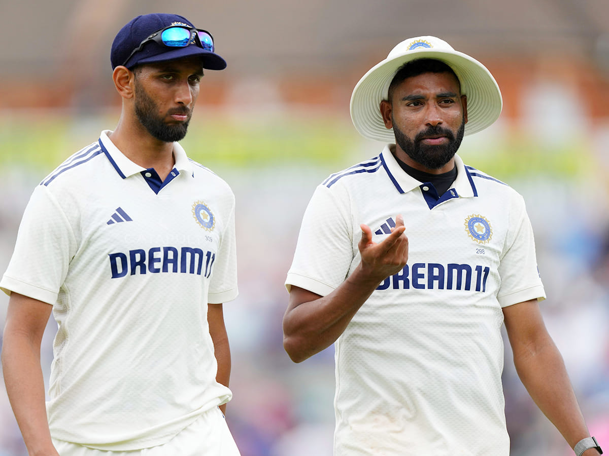 India's Mohammed Siraj, right, talks with Prasidh Krishna as they walks towards pavilion after winning the fifth Test against England at The Kia Oval in London, Monday, August 4, 2025.