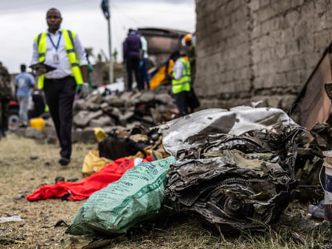 Debris of an airplane belonging to the African Medical and Research Foundation (AMREF) lies scattered after it crashed into a residential building in the Mwihoko area of Ruiru, in Kiambu County, Kenya, on Thursday, August 7, 2025. 