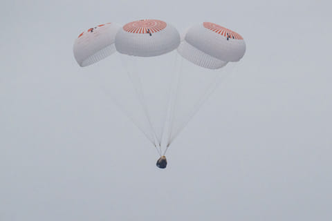 This picture provided by NASA shows the SpaceX Crew Dragon Endurance spacecraft as it lands with NASA astronauts Anne McClain and Nichole Ayers, Japan Aerospace Exploration Agency (JAXA) astronaut Takuya Onishi, and Roscosmos cosmonaut Kirill Peskov aboard in the Pacific Ocean off the coast of San Diego, California, on August 9, 2025.