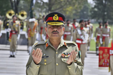 Pakistan Army Chief Field Marshal Asim Munir prays after laying wreath on the Martyrs monument during a special guard of honuor ceremony at General Headquarters, in Rawalpindi, Pakistan. File photo