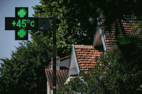 A pharmacy sign indicates a temperature of 45°C in Toulouse, southwestern France on August 11, 2025.  