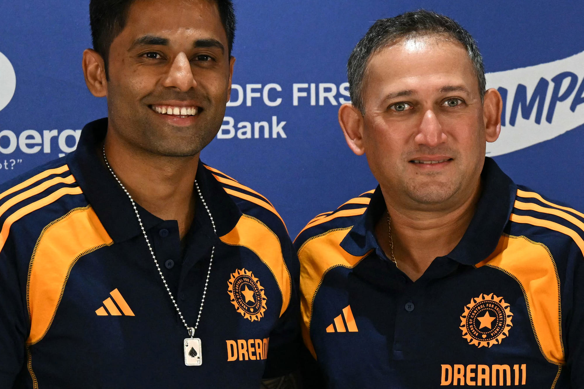 Indian cricket captain Suryakumar Yadav and Ajit Agarkar wear the Indian jersey's with Dream11 logos.