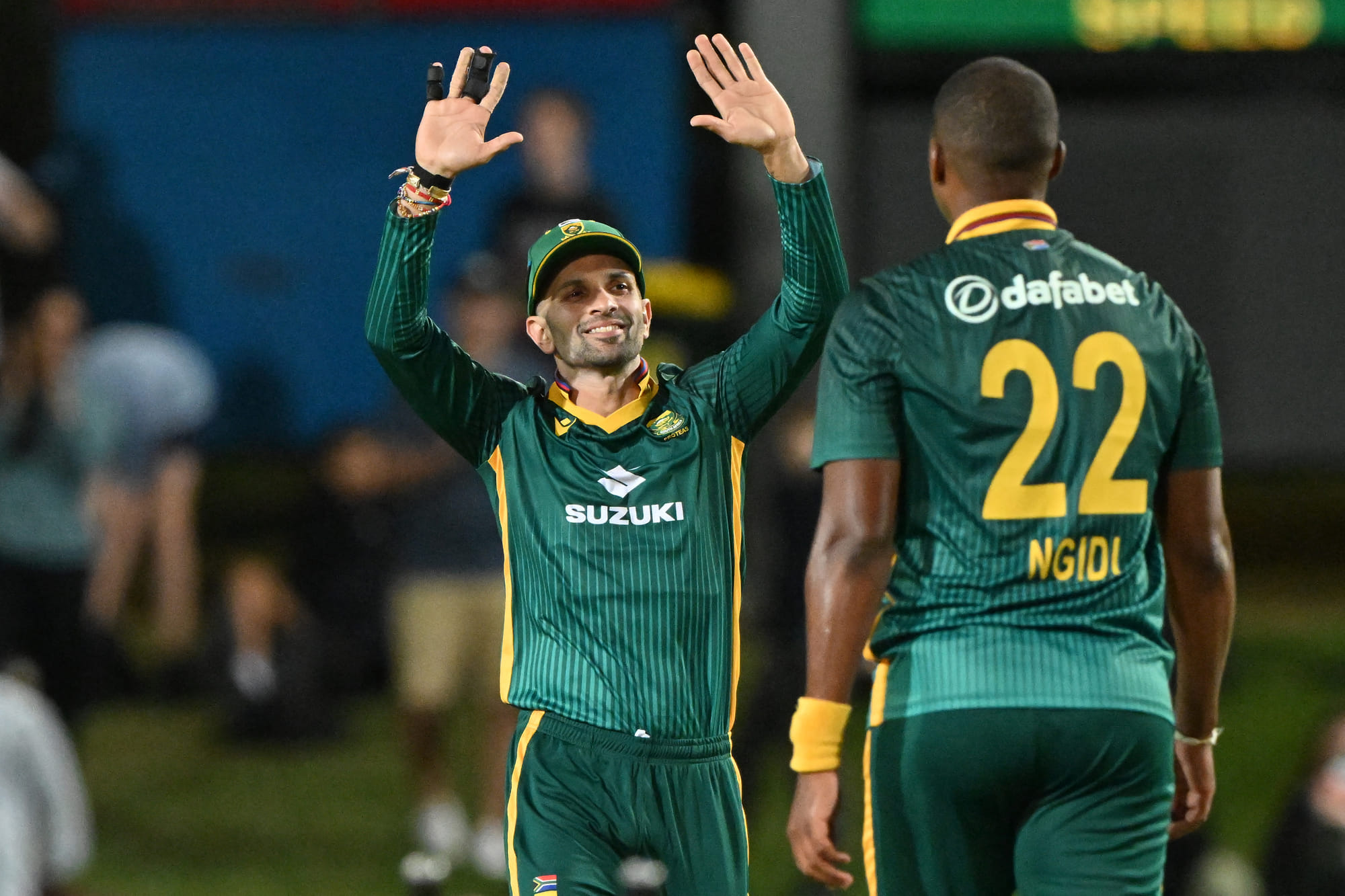 South Africa’s Keshav Maharaj (left) celebrates victory with Lungi Ngidi after the dismissal of Australia’s Adam Zampa during the first ODI at Cazaly's Stadium in Cairns on August 19, 2025.