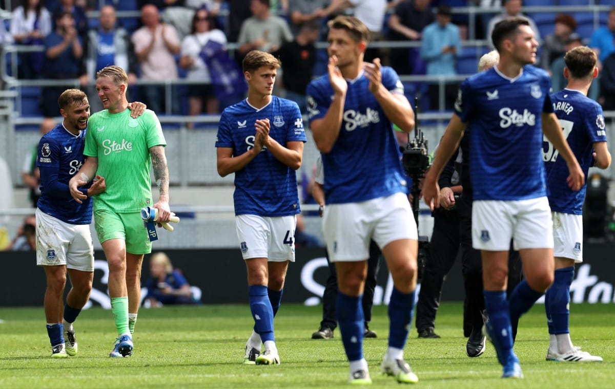 Everton's English midfielder Kiernan Dewsbury-Hall (L) jokes with Everton's English goalkeeper Jordan Pickford after the English Premier League football match against Brighton and Hove Albion at Hill Dickinson Stadium in Liverpool, north west England on August 24, 2025.