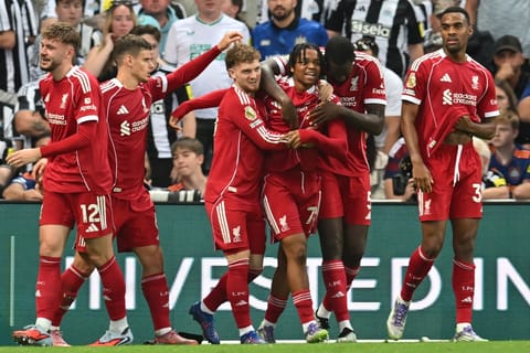 Liverpool's English strikerRio Ngumoha (C) celebrates with teammates after scoring their third goal during the English Premier League football match against Newcastle United at St James' Park in Newcastle-upon-Tyne, north east England on August 25, 2025.