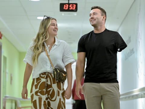 Joshua Arnold with his fianceee Alyssa Acker in Abu Dhabi, following his life-changing surgery.