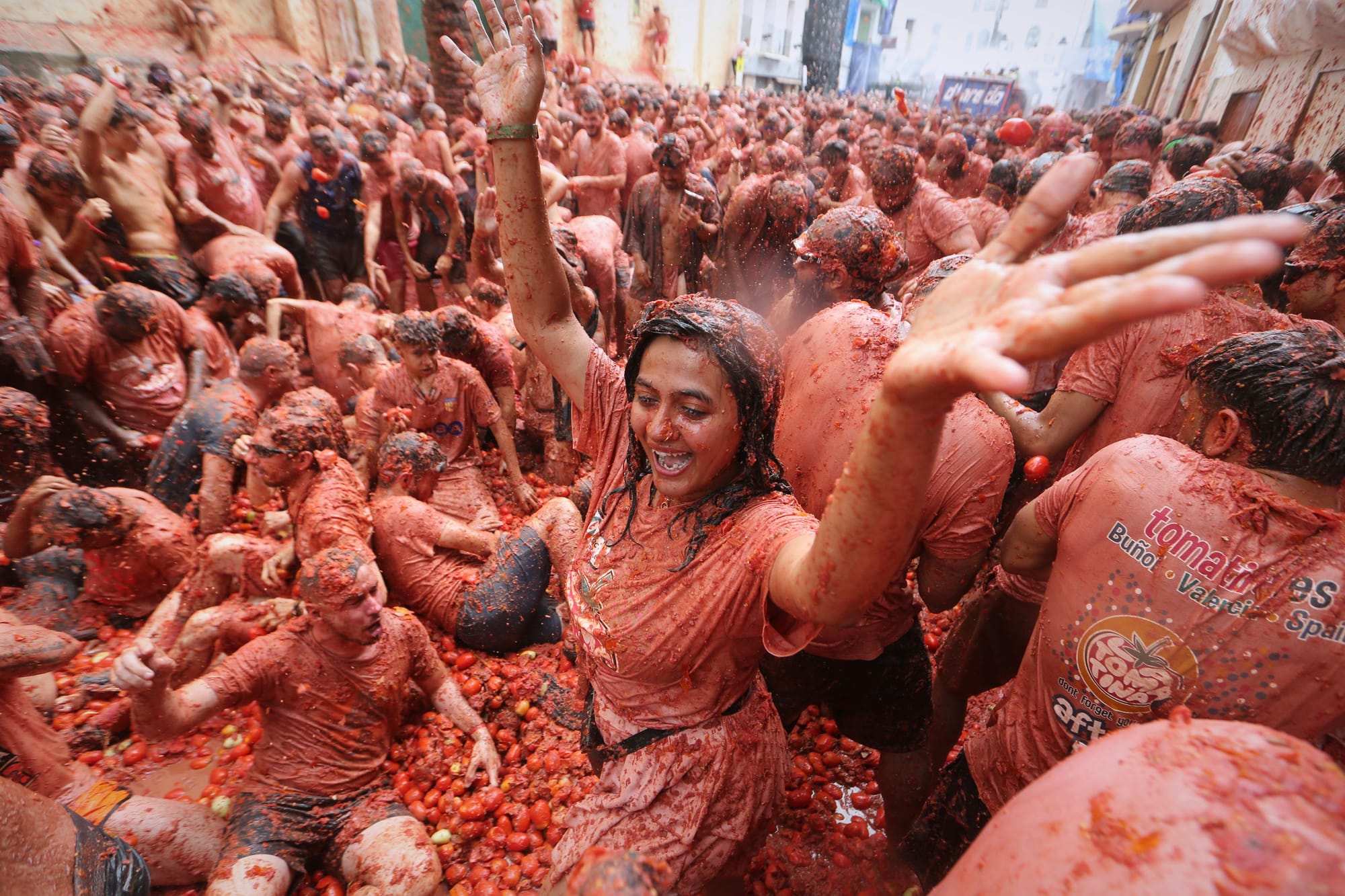 Revelers throw tomatoes at each other during the annual "Tomatina" tomato fight fiesta, in the village of Bunol near Valencia, Spain.