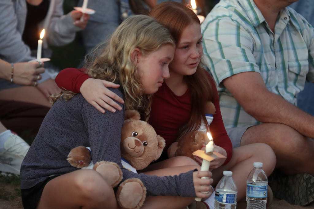 People gather at a vigil at Lynnhurst Park after a shooting at the Annunciation Catholic School, Wednesday, Aug. 27, 2025, in Minneapolis.