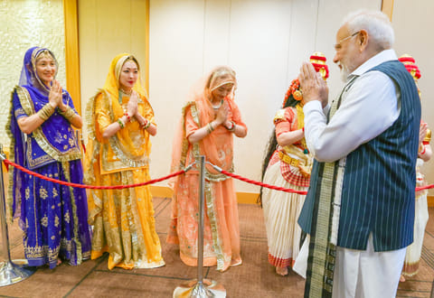Prime Minister Narendra Modi receives a rousing welcome from the Japanese artists upon his arrival at a hotel in Tokyo, Japan, Friday, August 29, 2025. 