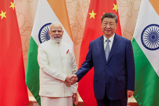 China's Xi and India's Modi vow to resolve border differences at meeting in Tianjin