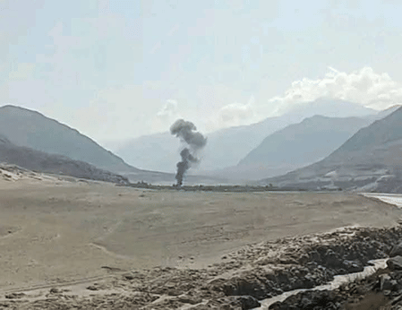A distant shot of the site of the helicopter crash