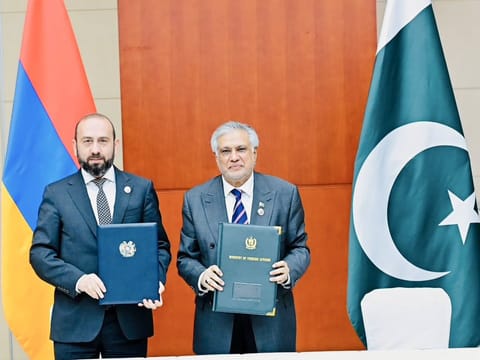 Pakistan Deputy Prime Minister and Foreign Minister Ishaq Dar with Foreign Minister of Armenia, Ararat Mirzoyan after agreement to establish diplomatic relations