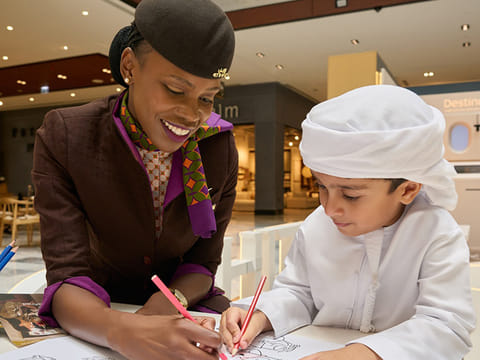 Airline staff interact with children visiting the Etihad Airlines activation in Galleria Mall, Abu Dhabi. 