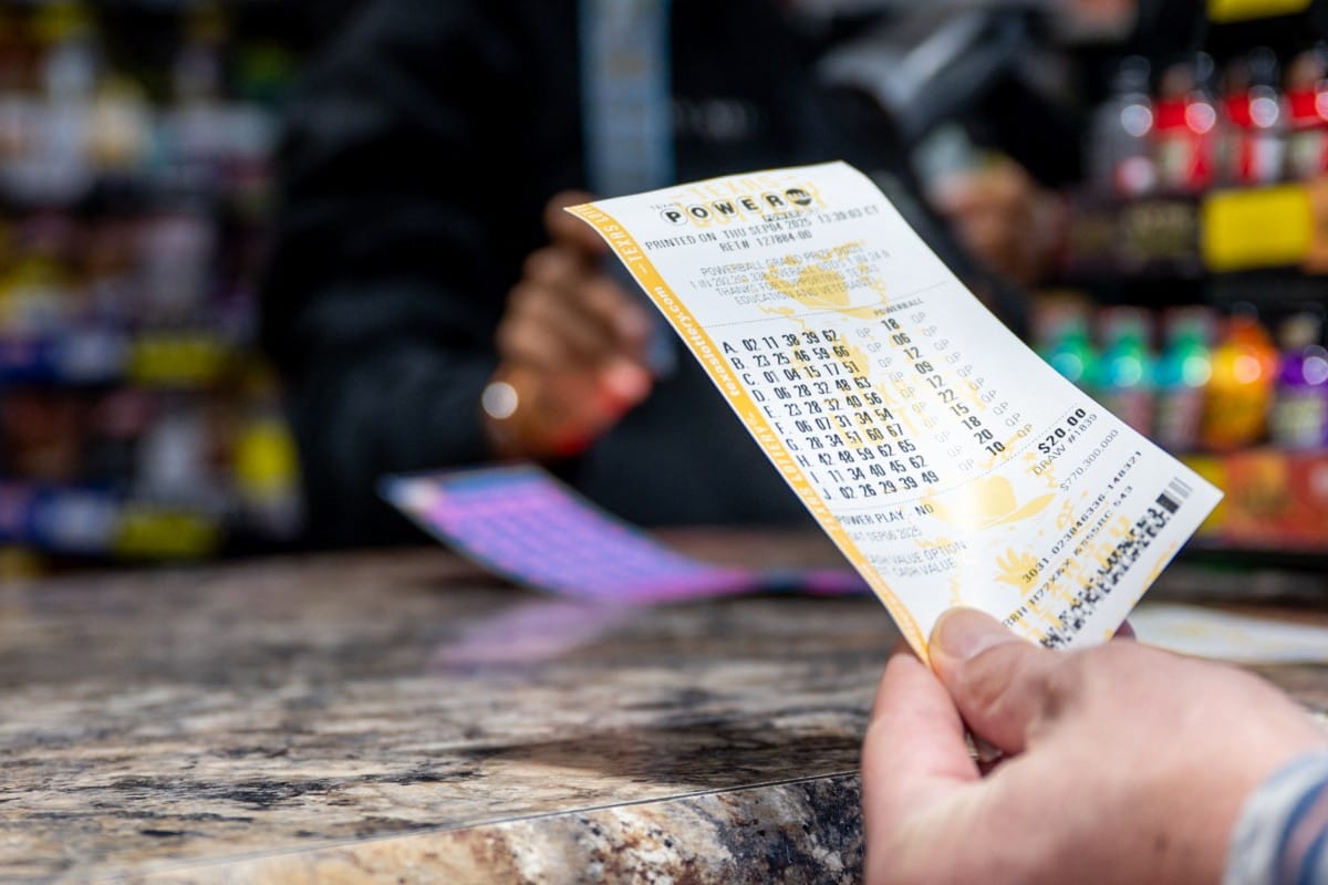 A person holds a Powerball lottery ticket they purchased at the Brew Market & Cafe on September 04, 2025 in Austin, Texas. For illustrative purposes only.
