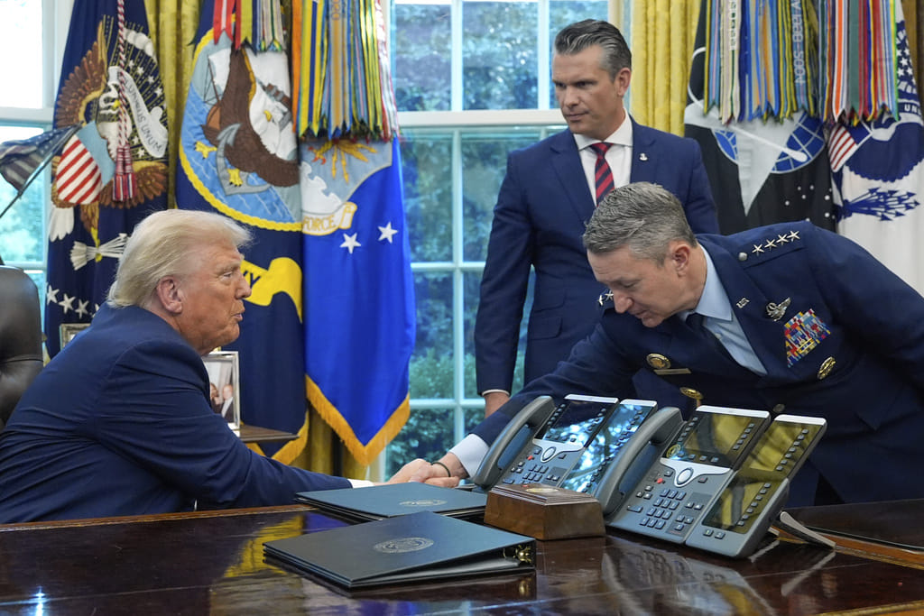President Donald Trump with Chairman of the Joint Chiefs of Staff Gen. Dan Caine as Defence Secretary Pete Hegseth watches in the Oval Office of the White House. Trump struck an optimistic tone on Wednesday, saying the US and Iran had held “good talks over the last 24 hours” and suggesting a deal could emerge soon.