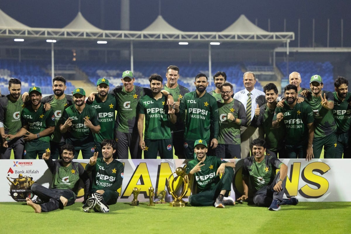 Pakistan's team pose with the trophy after winning the T20 international cricket match against Afghanistan in Sharjah on September 7, 2025.