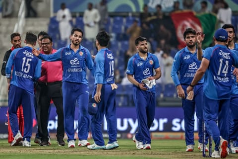 Afghanistan's players celebrate after winning the Asia Cup 2025 Twenty20 international cricket match between Afghanistan and Hong Kong at the Sheikh Zayed Cricket Stadium in Abu Dhabi on September 9, 2025.