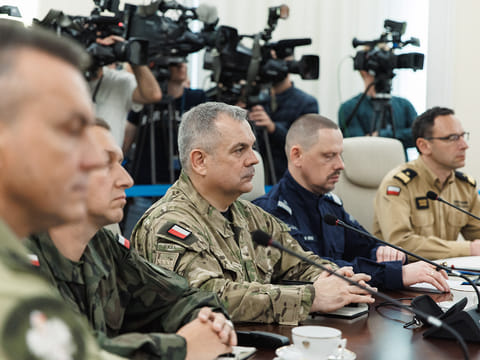 This September 10, 2025 hand out image released by the Polish Prime Ministers office shows General Wieslaw Kukula (C), Chief of the General Staff of the Polish Armed Forces attending an emegency meeting hosted by Poland's Prime Minister Donald Tusk (not in image) in Warsaw after drones violated Polish airspace. 