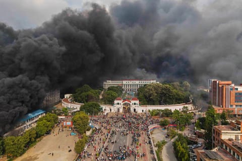 This week, streets once peaceful have erupted into scenes of fiery unrest as tens of thousands—dominated by Gen Z protesters—stormed government buildings, torched institutions, and challenged a system seen as entrenched in corruption. Above, protesters celebrate at the Singha Durbar, the seat of Nepal's government's various ministries and offices after it was set on fire during a protest against social media ban and corruption in Kathmandu. 