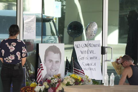 Well-wishers pay their respects at a makeshift memorial at the national headquarters of Turning Point USA shown after the shooting death of Charlie Kirk, the co-founder and CEO of the organisation, during a Utah college event Wednesday, Sept. 10, 2025, in Phoenix. 
