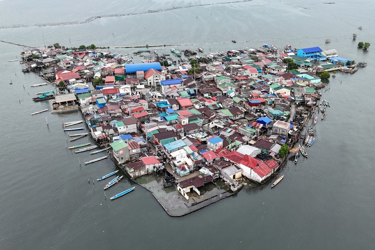 This aerial view shows cramped houses on Isla Pugad in Hagonoy town, Bulacan province, north of Manila.