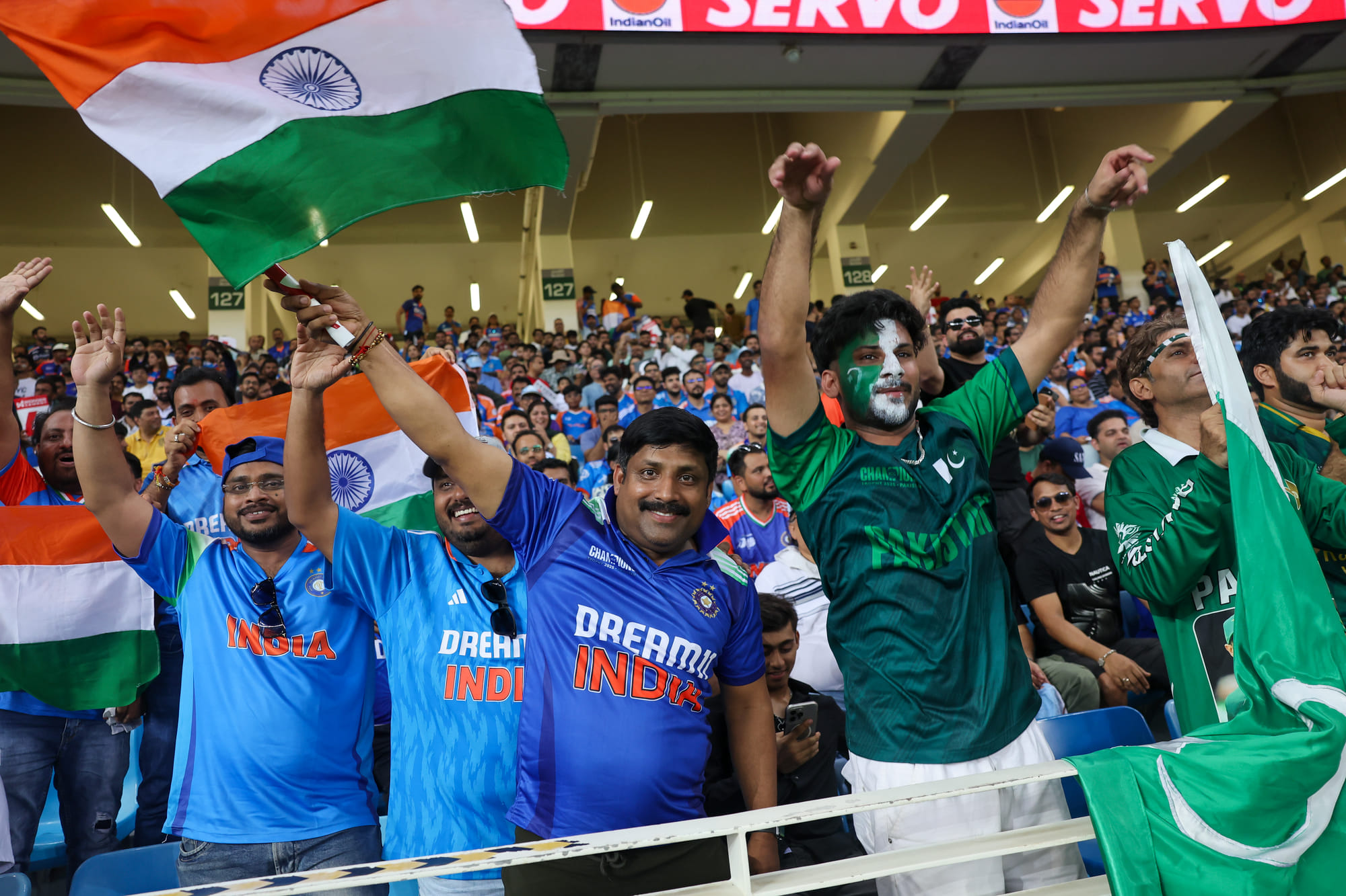 Indian and Pakistani fans together enjoy the India vs Pakistan clash at Dubai International Stadium during the DP World Asia Cup on Sunday. 