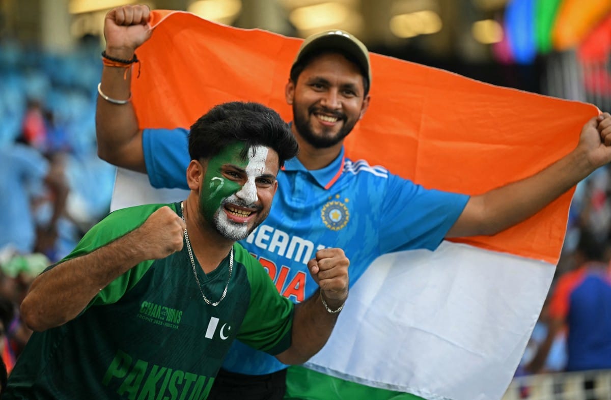 Pakistan and India fans cheer before the start of the Asia Cup 2025 Twenty20 international cricket match between India and Pakistan at the Dubai International Stadium in Dubai on September 14, 2025.