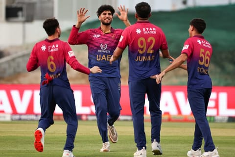 UAE's players celebrate after the dismissal of Oman's captain Jatinder Singh during the Asia Cup 2025 Twenty20 international cricket match between United Arab Emirates and Oman at the Sheikh Zayed Cricket Stadium in Abu Dhabi on September 15, 2025.