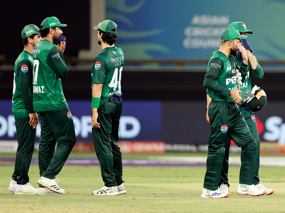 Pakistan's players look dejected after losing the Asia Cup 2025 match against India, at Dubai International Stadium in Dubai on Sunday.
