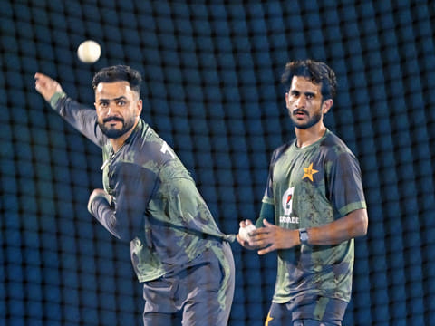 Pakistan's Mohammad Nawaz (L) and teammate Pakistan's Hasan Ali attend a practice session at ICC Academy in Dubai on September 16, 2025, ahead of their Asia Cup 2025 T20 match against the UAE. 