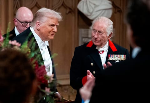 US President Donald Trump (L) reacts alongside Britain's King Charles III after delivering a speech during a State Banquet at Windsor Castle, in Windsor, on September 17, 2025, during the US President's second State Visit.