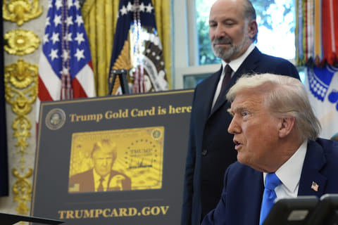 President Donald Trump speaks as Commerce Secretary Howard Lutnick listens in the Oval Office of the White House, Friday, Sept. 19, 2025, in Washington. (AP Photo/Alex Brandon)