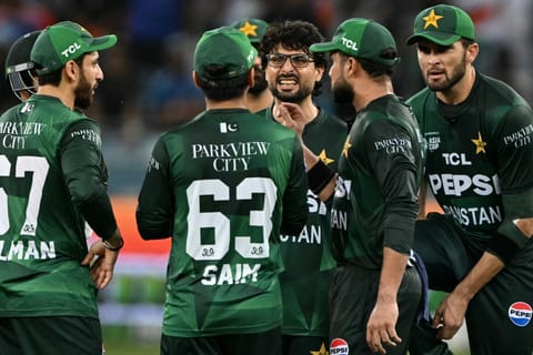 Pakistan's Abrar Ahmed (C) celebrates with teammates after taking the wicket of India's Abhishek Sharma during the Asia Cup 2025 