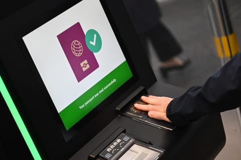 A person as their passport scanned whilst using an Automated European Union Entry/Exit System (EES) kiosk during a press preview on the rollout of the EU's new Entry-Exit System (EES) at Eurotunnel, south east England on September 23, 2025.