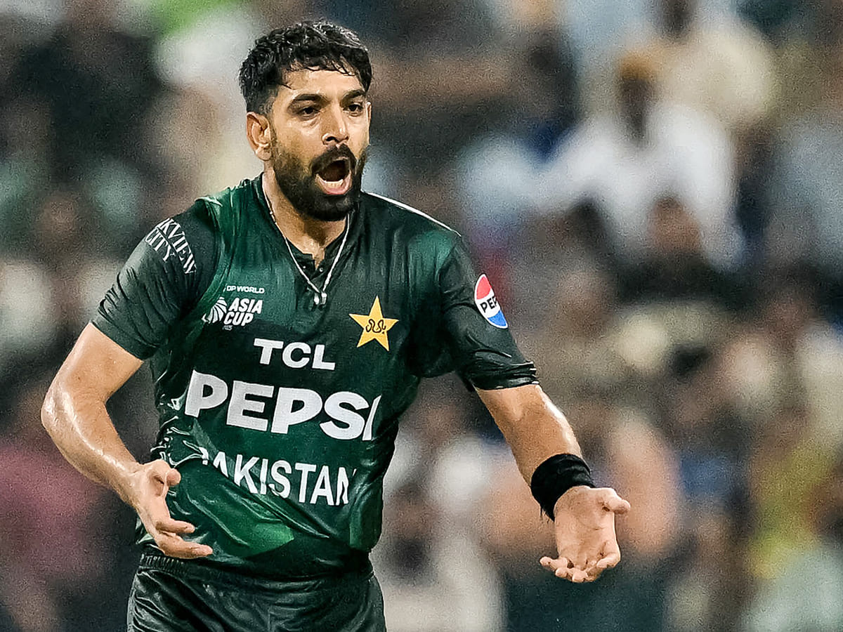 Pakistan's Haris Rauf reacts after a delivery during the Asia Cup 2025 Super Four T20I match against Sri Lanka at the Sheikh Zayed Cricket Stadium in Abu Dhabi on September 23, 2025. 