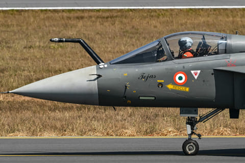The Indian Air Force (IAF) HAL Tejas fighter jet prepares to take off during Aero India 2025, a military aviation exhibition at the Yelahanka Air Force Station in Bengaluru on February 13, 2025.  