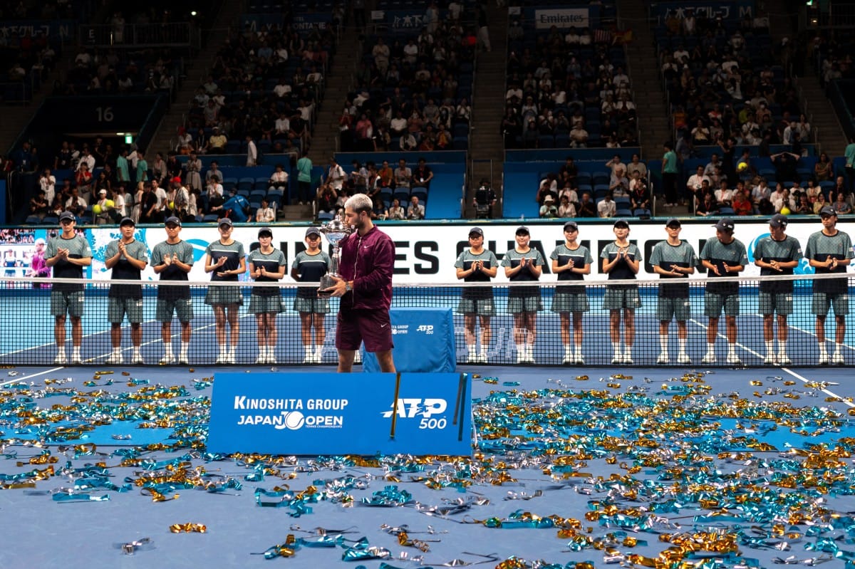 Spain's Carlos Alcaraz celebrates during the award ceremony after winning the men’s singles final match against USA's Taylor Fritz at the ATP Japan Open tennis tournament in Tokyo on September 30, 2025.