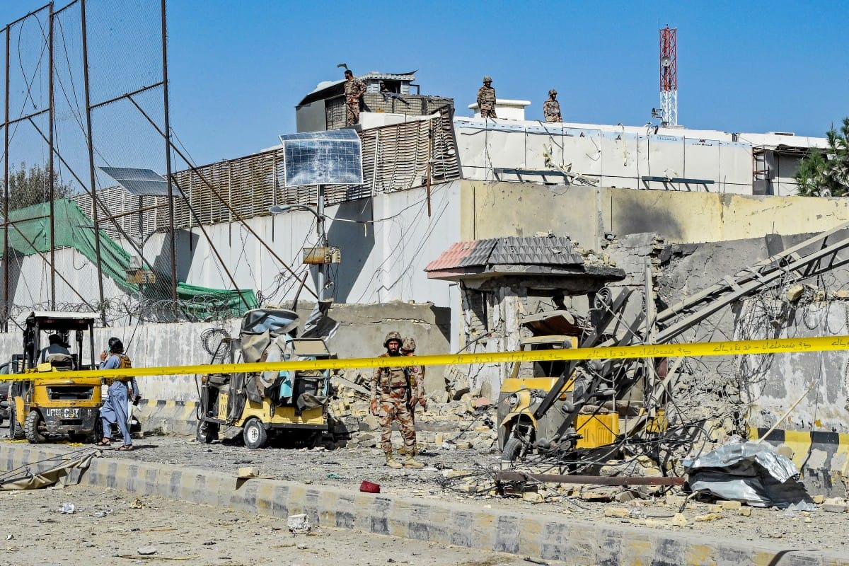 Security personnel inspect an explosion site outside the Frontier Corps (FC) headquarters in Quetta on September 30, 2025.