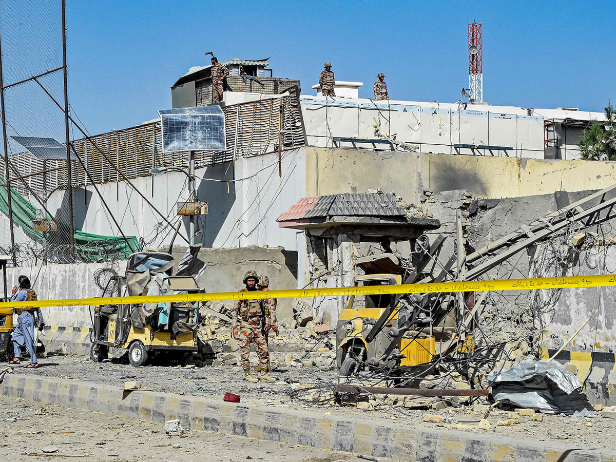 Security personnel inspect an explosion site outside the Frontier Corps (FC) headquarters in Quetta, Pakistan, on September 30, 2025. 