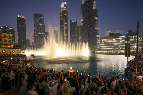 Huge crowd gathered to was Dubai fountain re opening in front of Burj Khalifa.  