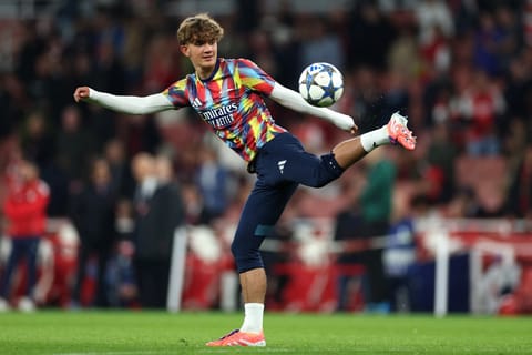 Arsenal's English midfielder Max Dowman warms up ahead of the Uefa Champions League, league phase football match against Olympiacos at the Emirates Stadium in north London on October 1, 2025.