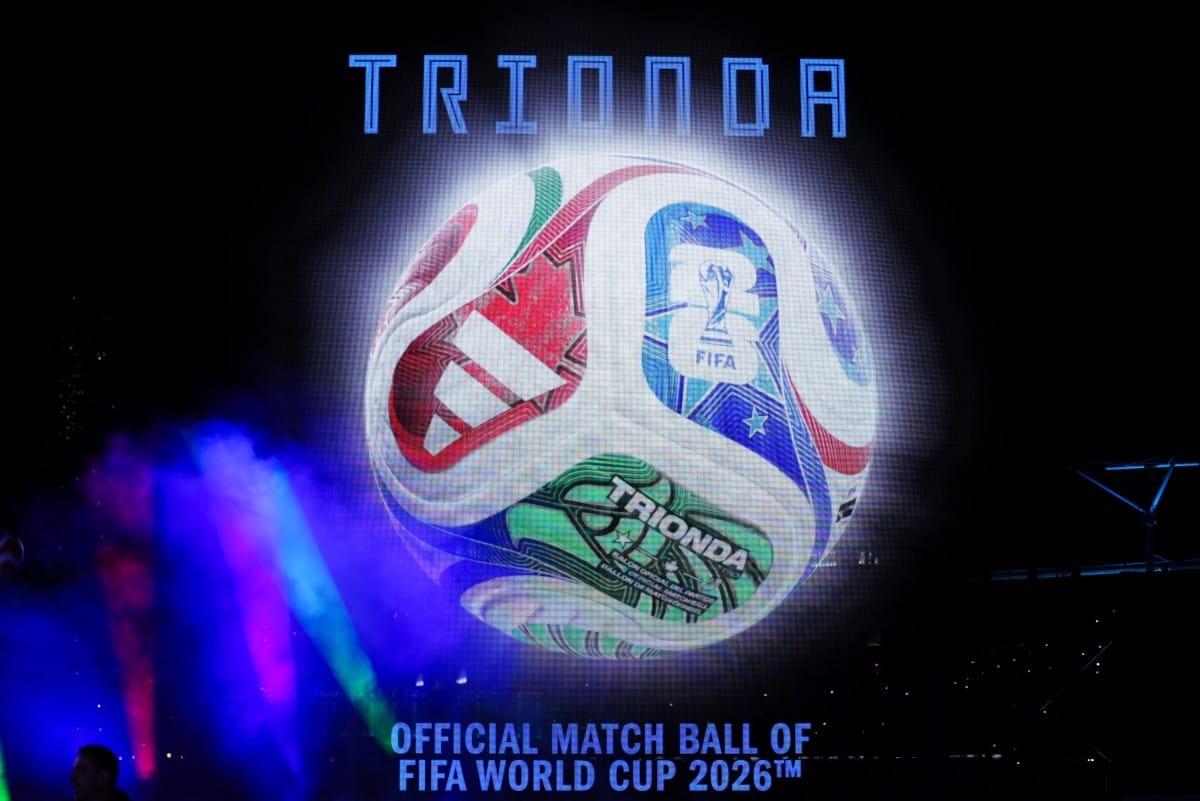 A large video screen shows the 2026 FIFA Men's World Cup match ball named Trionda during its unveiling in New York on October 2, 2025.