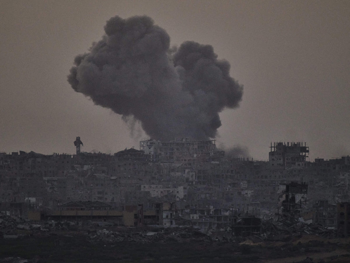 Smoke rises amid buildings, that were destroyed during the Israeli ground and air operations, following an Israeli military strike in the northern Gaza Strip, as seen from southern Israel, Friday, October 3, 2025. 