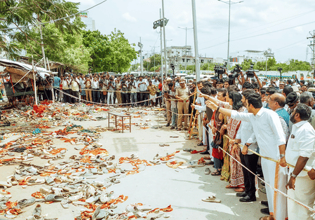 People gather at the place where the stampede occurred.