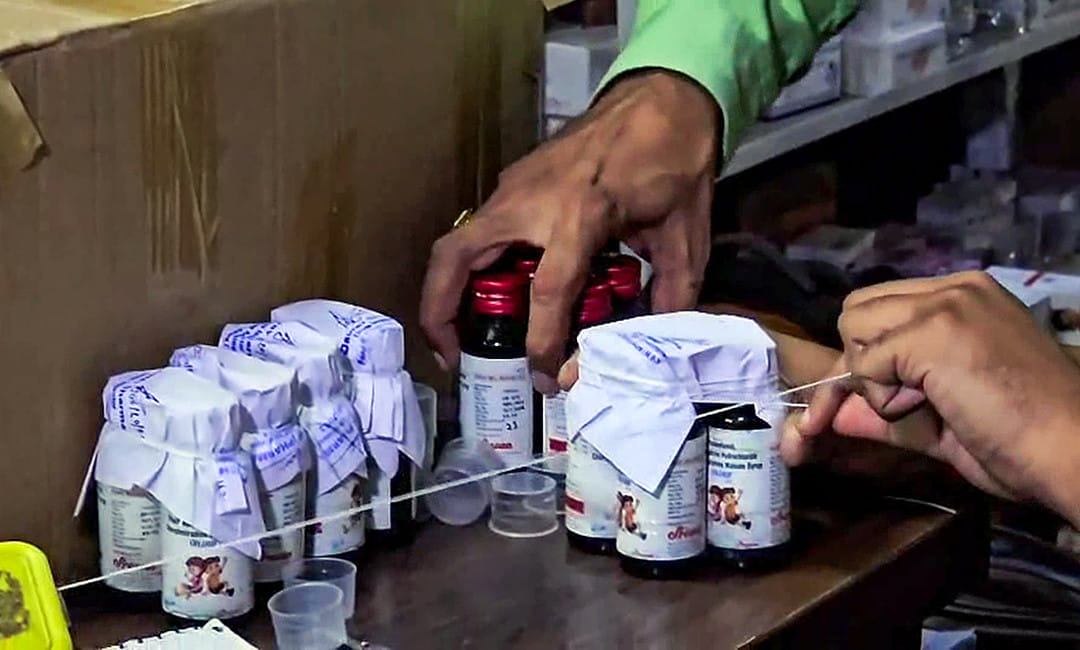 The Drugs Department sealing the Coldrif cough syrup containers during a raid on an Ayush firm, in Chhindwara.