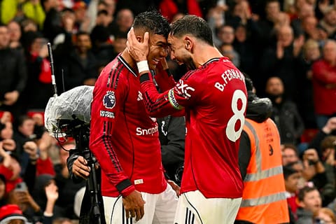 Manchester United's Brazilian midfielder Casemiro celebrates scoring the team's second goal during the English Premier League football match against Chelsea at Old Trafford in Manchester, north west England, on September 20, 2025.